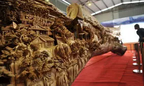 تصاویری زیبا از خلق آثار هنری در برف و چوب