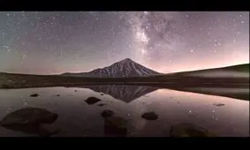 بیرون آمدن دماوند و کهکشان راه شیری از پشت ابرها/ ویدئو