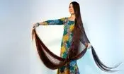 زنی با موهای ۲.۷ متری رکورد گینس را شکست | عکس
