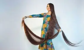 زنی با موهای ۲.۷ متری رکورد گینس را شکست | عکس