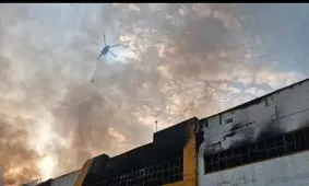 ورود بالگردهای هلال احمر مازندران برای مهار آتش در مجتمع ونوس انزلی