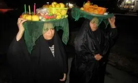 سینی‌گردانی میراث معنوی مردم اهواز/ عطری آمیخته با شمع و سیب و بخور