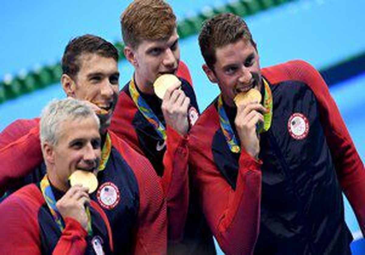 چرا مدال آوران المپیک، مدال‌هایشان را به دندان می‌گیرند؟