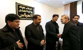 حضور لاریجانی در منزل شهید ابومهدی المهندس و سردار شهید حسین پورجعفری