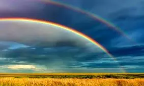 چرا رنگین کمان به شکل کمان است؟