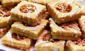 طرز تهیه شیرینی عسلی بادامی مغزدار