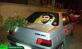 تزئین ماشین عروس با تصویری از شهید حججی
