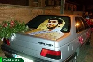 تزئین ماشین عروس با تصویری از شهید حججی