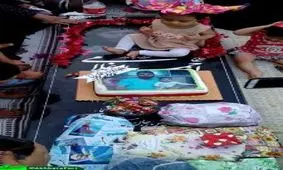 تولد یکسالگی دختر شهید مدافع حرم بر سر مزار پدر