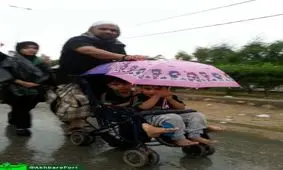 پیاده روی اربعین زیر بارش باران