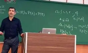 تصویری از استاد اخراجی شریف در میان طراحان سوال المپیاد جهانی