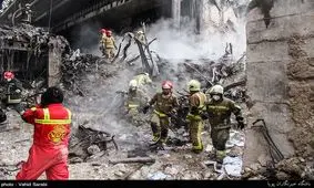 علت کشف تعدادی لباس آتش‌نشانی بدون پیکر در پلاسکو/ علت خروج دود سفید از آوار