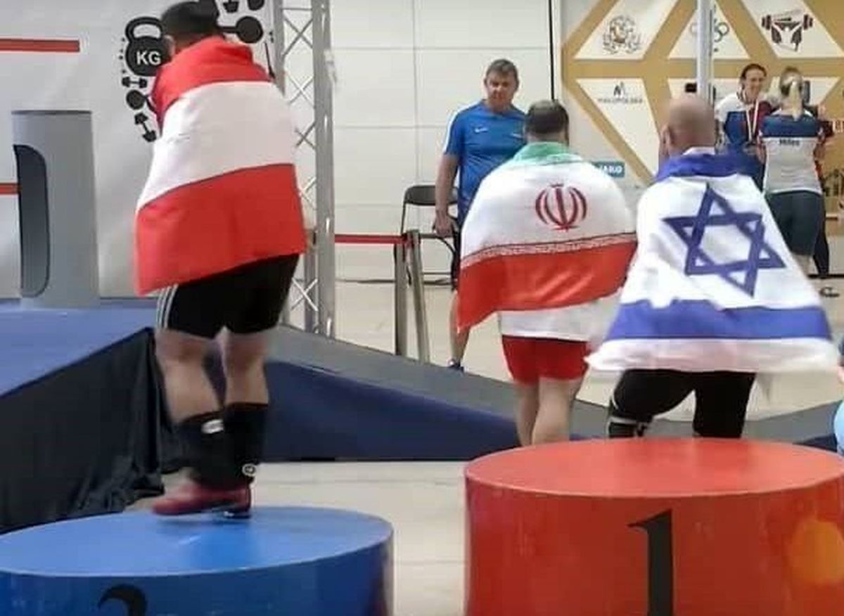 خوش و بش مصطفی رجایی با نماینده اسرائیل در مسابقات پیشکسوتان وزنه برداری/ ویدئو