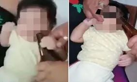 اقدام احمقانه معلم در خوراندن مشروبات الکلی به کودک! +فیلم
