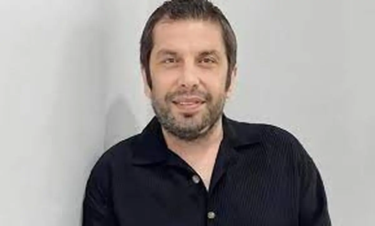  عباس جمشیدی‌فر در آغوش پدرش در ایام کودکی
