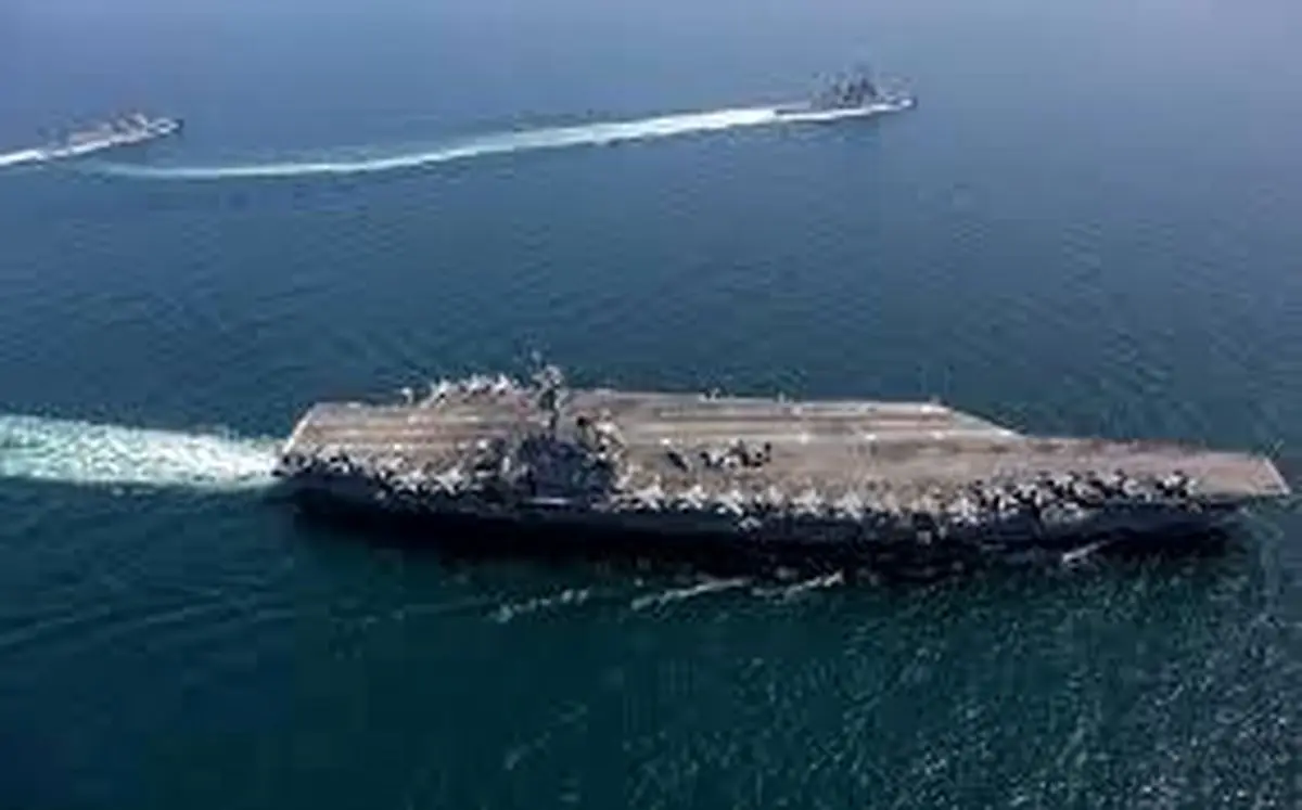 تنش دریایی اوج گرفت؛ شلیک ناو هواپیمابر آمریکا به پهپاد ایرانی / ایران پهپادی دیگر اعزام کرد/ عکس
