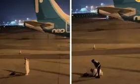 نماز خواندن یک مسافر در باند فرودگاه!/ ویدئو